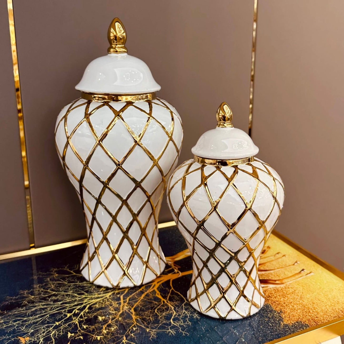 White and gold ceramic ginger jar with lid, decorative farmhouse tabletop and wedding décor piece.