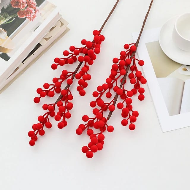 Five artificial long berry stems measuring forty three centimetres.