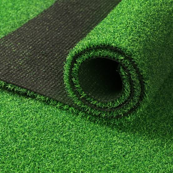 Artificial grass carpet roll with realistic green finish and thick pile