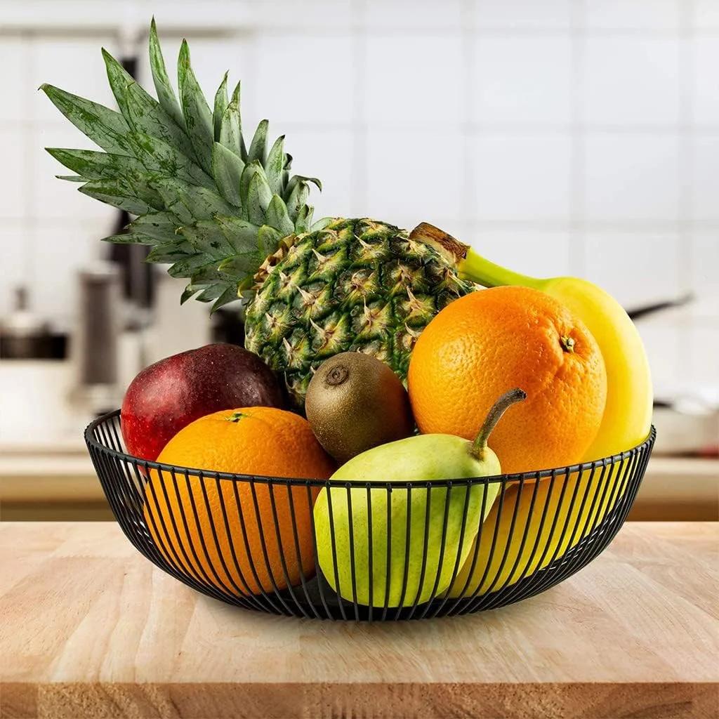 Black oval shaped metallic fruit basket.