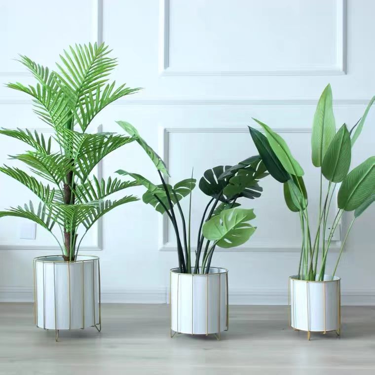 Three piece floor standing flower pot set in black and white without plants