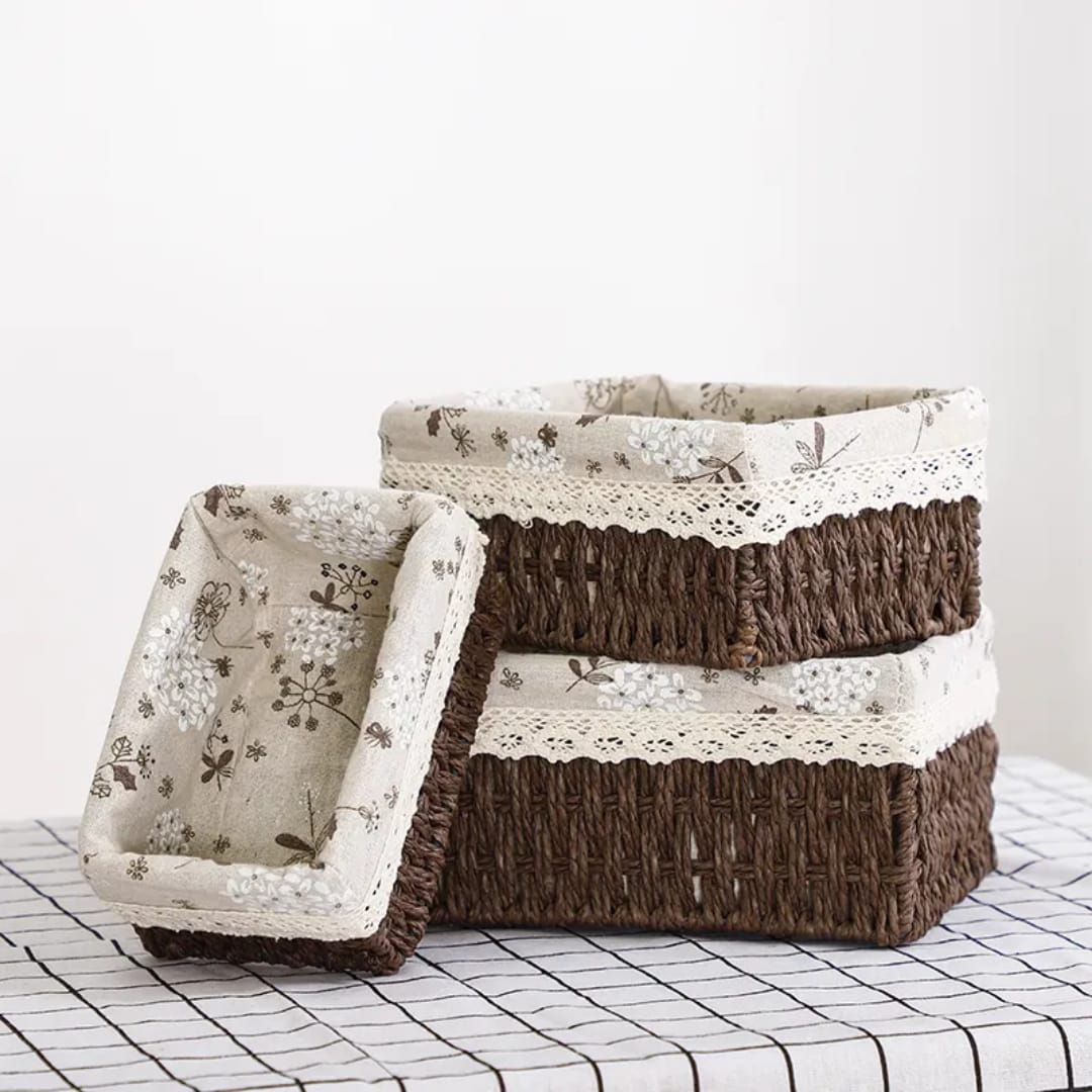 Set of three woven paper rope baskets with removable lining in coffee brown color