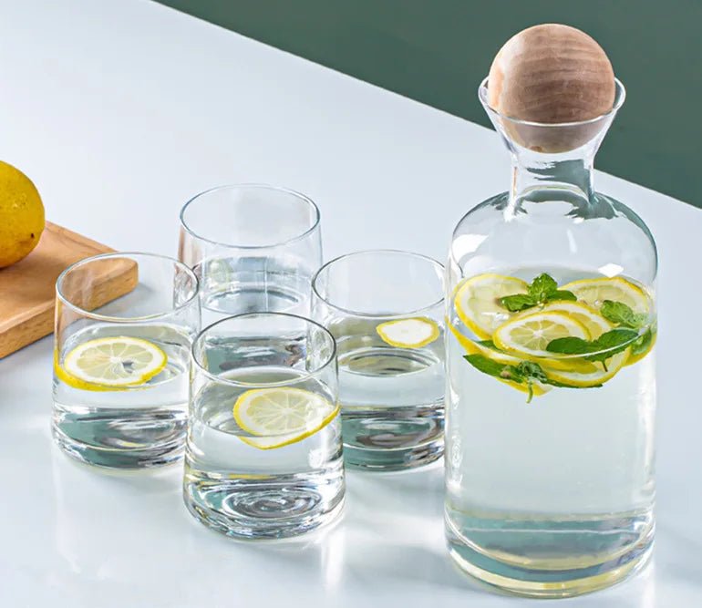 Seven piece decanter set with one round decanter and six glasses.