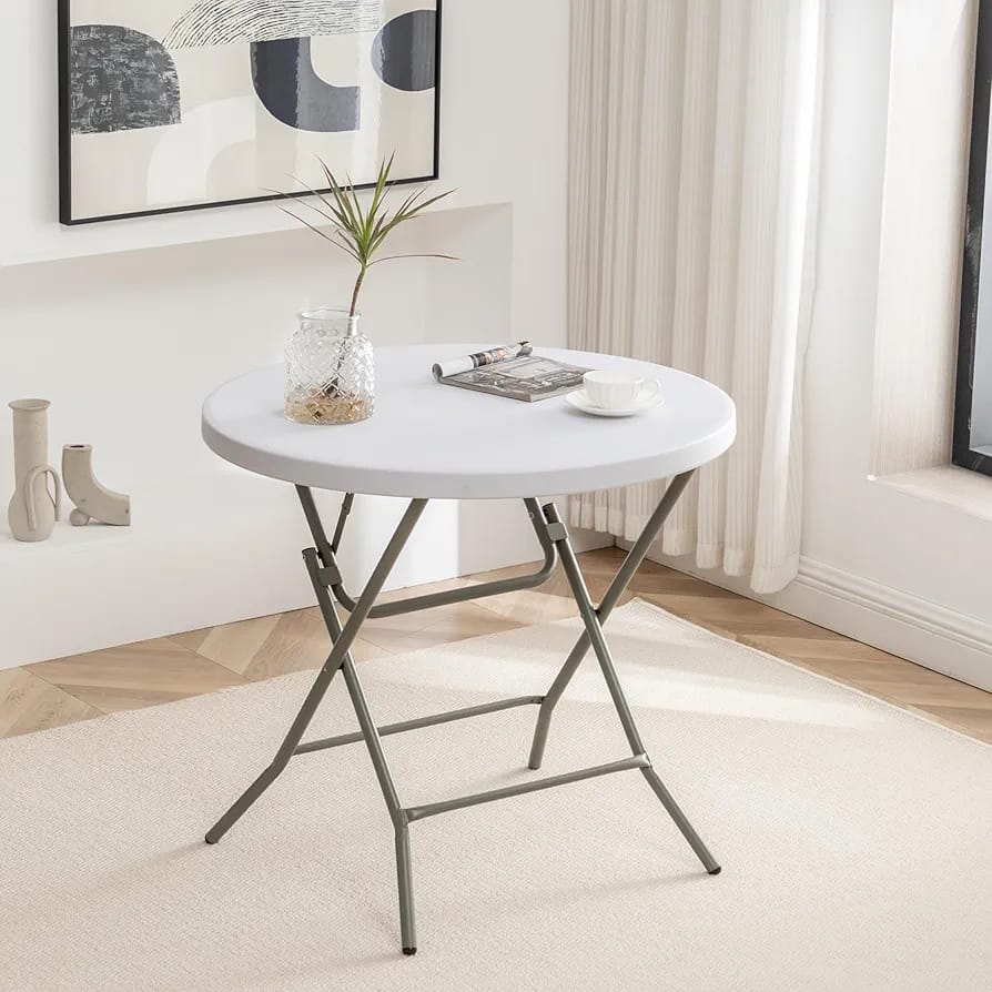 Foldable round table made of durable moulded plastic, 80cm wide and 74cm high