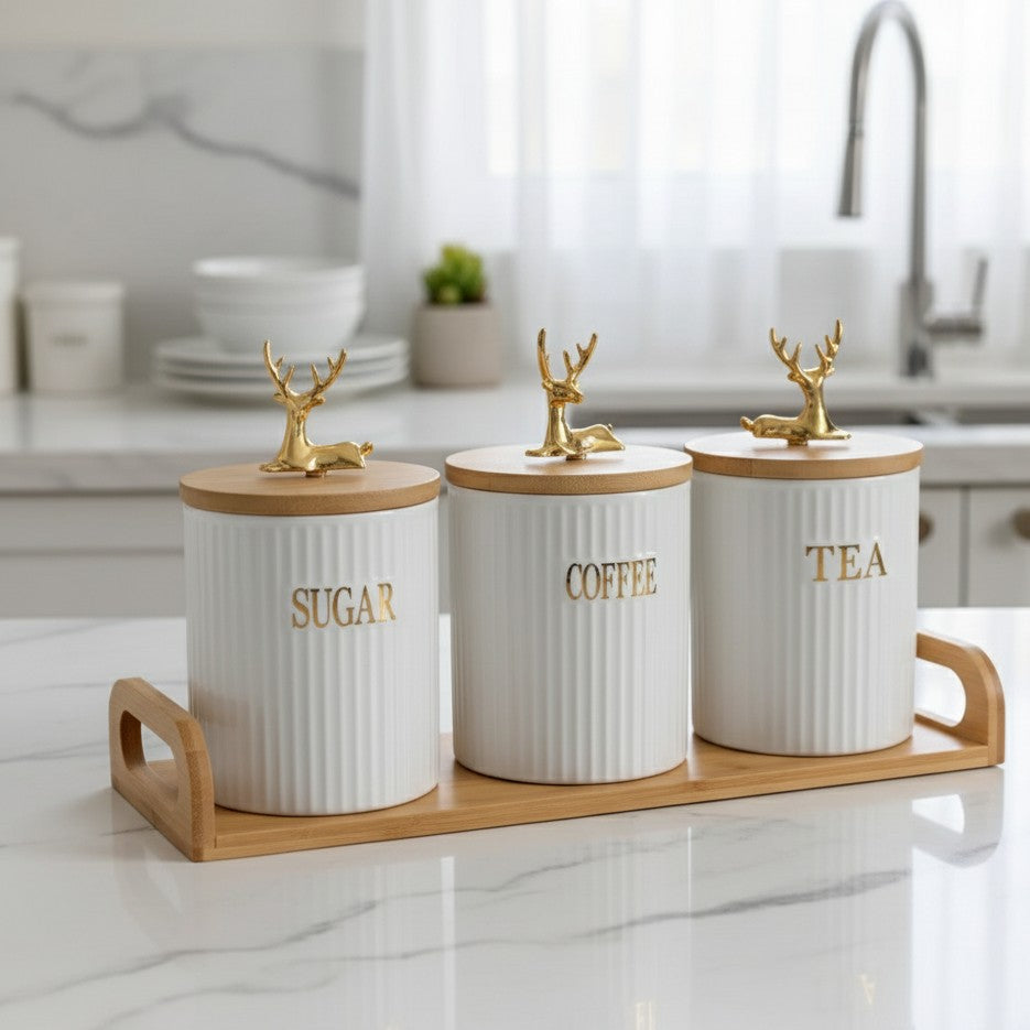 Porcelain canister set with bamboo lid and gold reindeer on tray