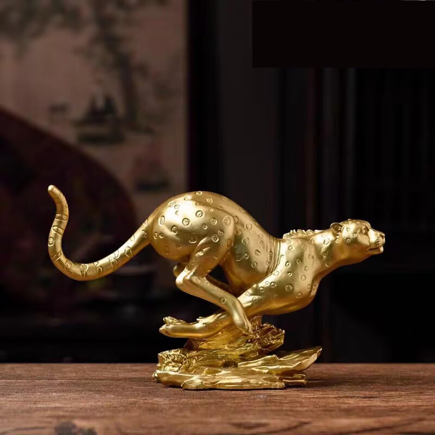 Gold resin leopard statue decorative figurine designed for luxury home or office décor display.