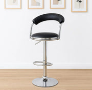 Black PU leather swivel bar stool with padded C-shaped backrest, chrome hydraulic base, circular footrest, and adjustable heigh