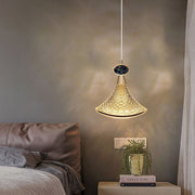 Dawood Lifestyle & Gadgets kes gold mesh cone pendant light with laser-cut metal pattern, smoked crystal accent, and luxury ceiling-mounted design creating decorative shadow effects for modern interiors.