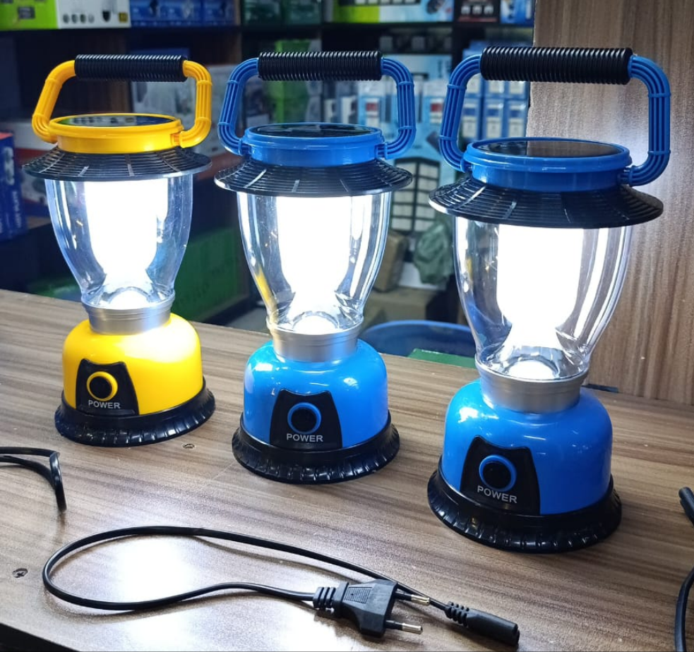 Portable solar rechargeable camping light with handle and dual charging options