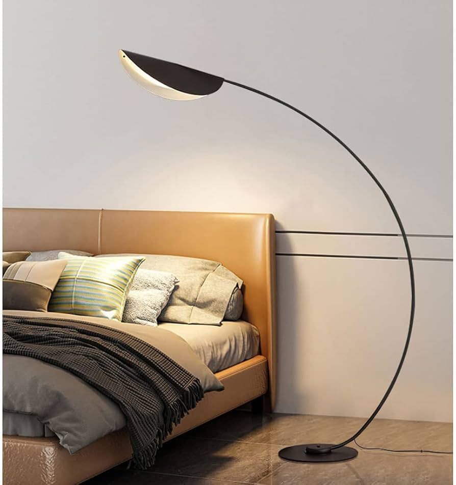 Curved floor lamp with stable base and soft ambient lighting for living room or bedroom use