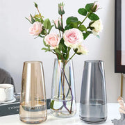 21.8cm tapered glass vase in clear, smoky grey, or amber, ideal for fresh or dried flowers.