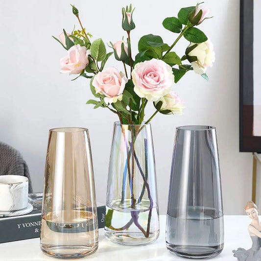 21.8cm tapered glass vase in clear, smoky grey, or amber, ideal for fresh or dried flowers.