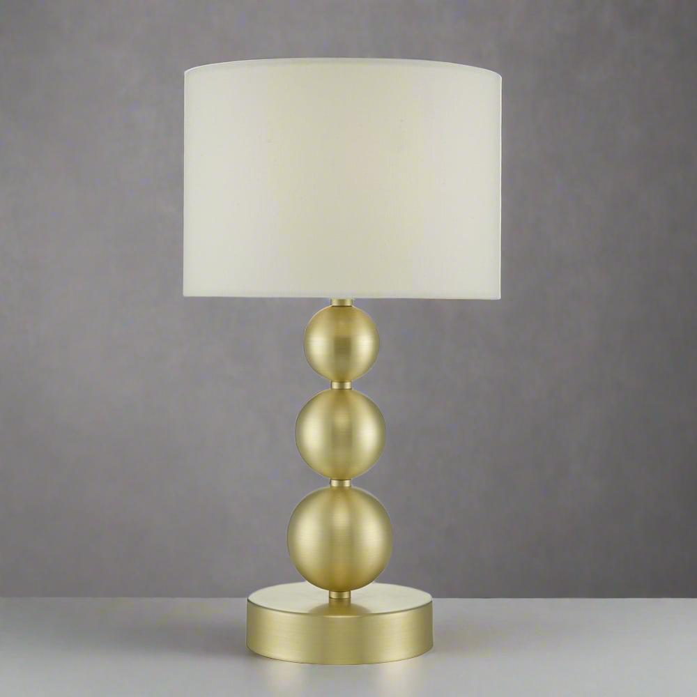 Brass stacked balls table lamp with white shade for modern living room or bedroom décor