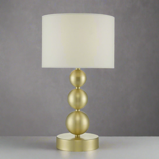 Brass stacked balls table lamp with white shade for modern living room or bedroom décor