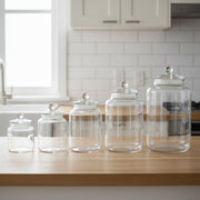 Clear glass storage jars with airtight lids available in multiple sizes for kitchen organization and dry food storage