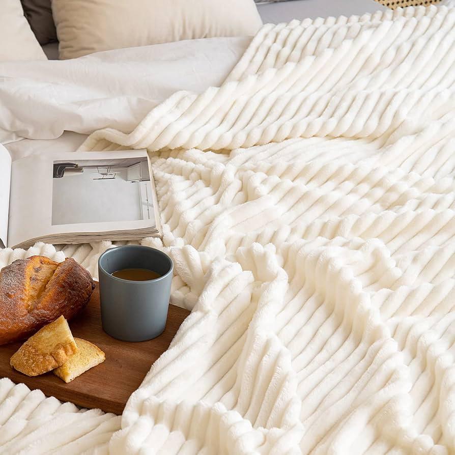 Large fleece throw blanket sized 230x200cm for bedding or décor.