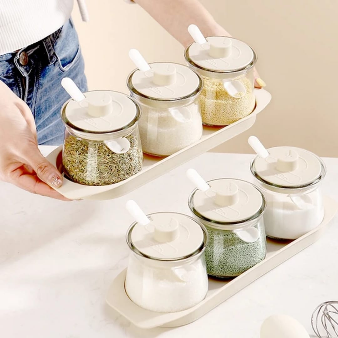 Set of three clear borosilicate glass spice canisters with airtight lids
