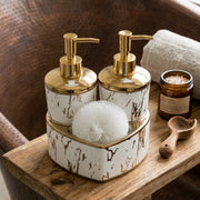 White and gold porcelain heart shaped soap dispenser set with matching scrub for bathroom and kitchen décor.