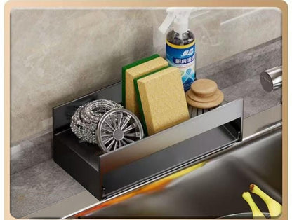 Compact countertop drain rack for holding sponges and detergents.