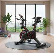 Portable indoor spin bike with adjustable seat, sensors, and transport wheels for home fitness