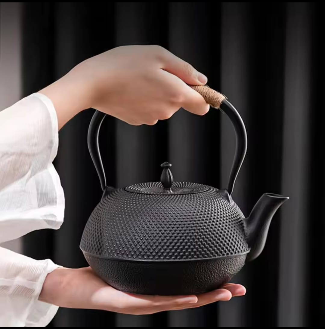 Cast iron tea pot with infuser, cast iron coaster and spoon