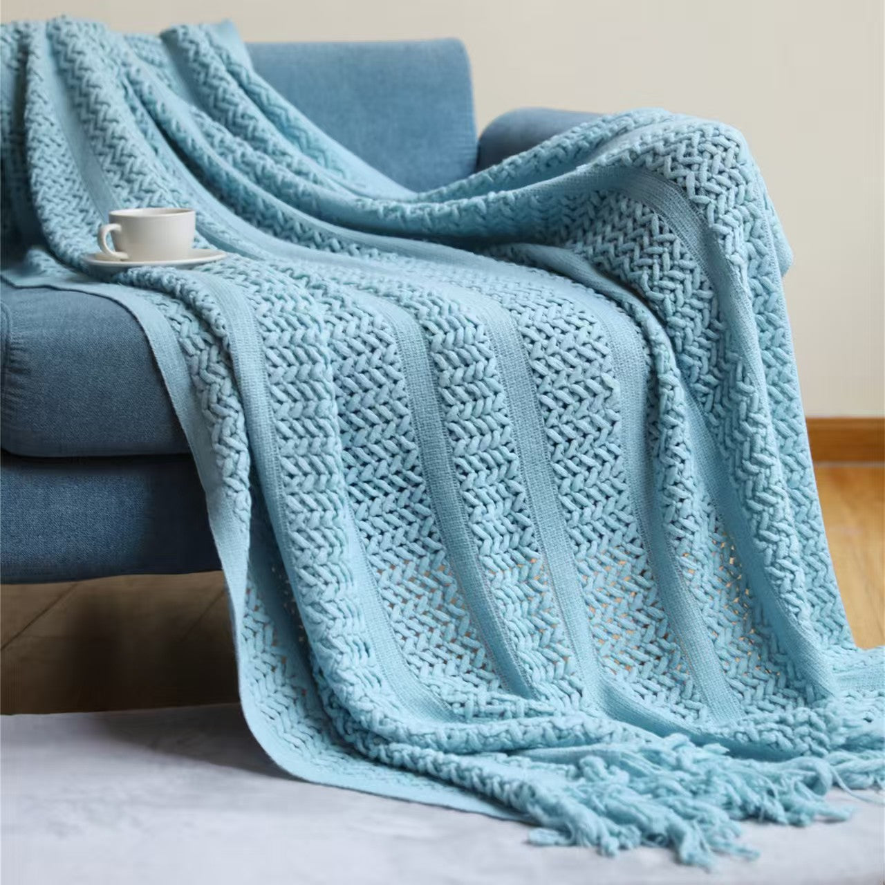 Large throw blanket sized 130 × 230 cm draped over a sofa for warmth and home décor.