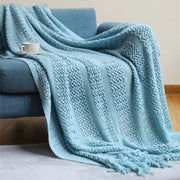 Large throw blanket sized 130 × 230 cm draped over a sofa for warmth and home décor.