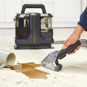 Handheld wet and dry fabric cleaner with double head stain removal system for sofas, carpets, and upholstery. 
