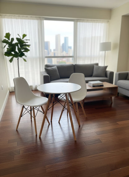 Scandinavian style two-seater dining table with matching chairs in a minimalist design.