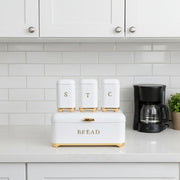 Kitchen bread bin with three matching storage canisters.