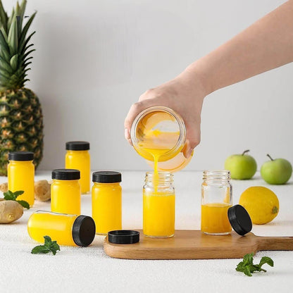 6 Piece reusable glass ginger shot bottles with black lids and 60ml capacity