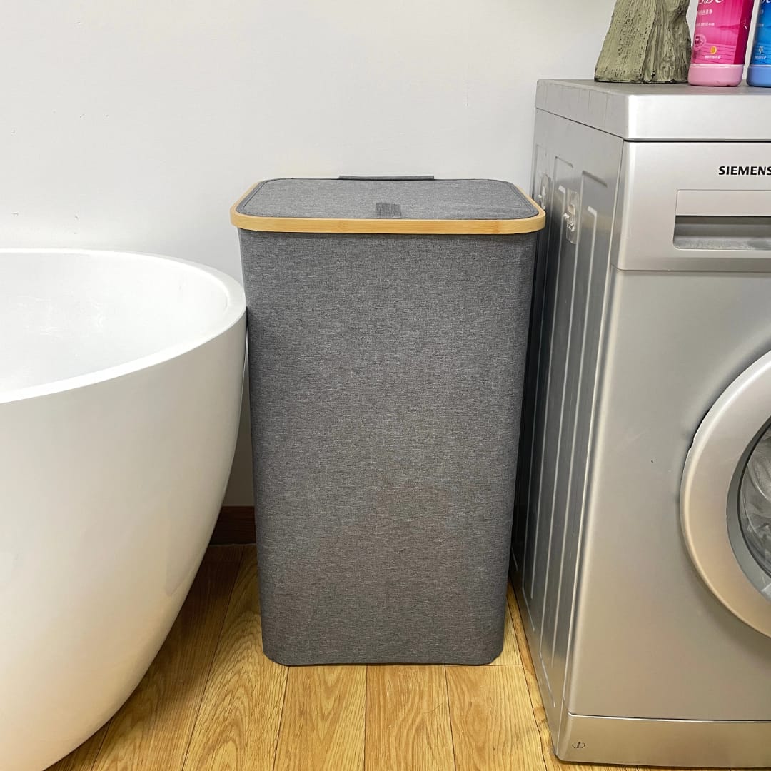 Large black and grey laundry basket with big capacity.