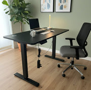 Adjustable office table with ergonomic height feature and sturdy frame.