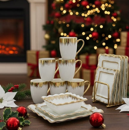 24 piece white ceramic dinner set with gold detailing, including plates, bowls, and mugs