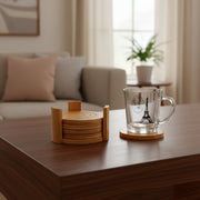 Set of 6 round bamboo coasters on a table.