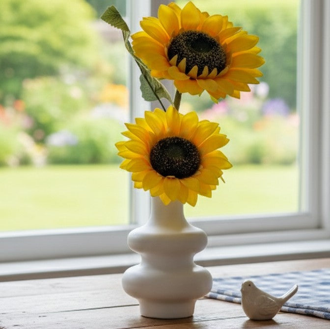 Nordic-style plastic vase with vibrant sunflower arrangement