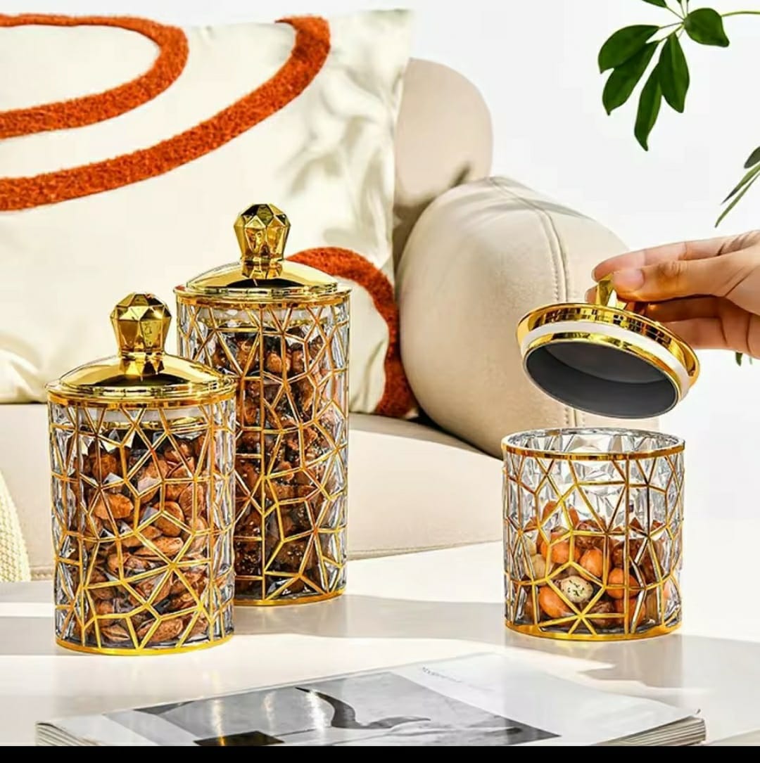 Set of three square transparent acrylic storage jars with gold lines
