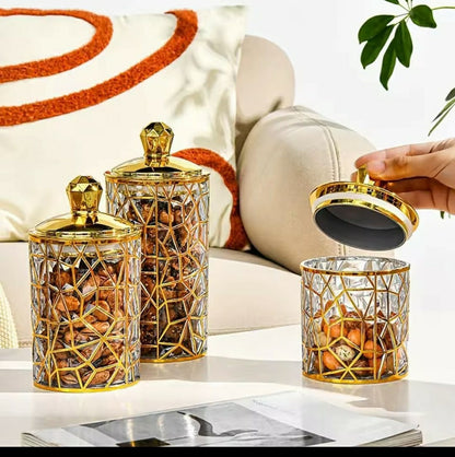 Set of three square transparent acrylic storage jars with gold lines

