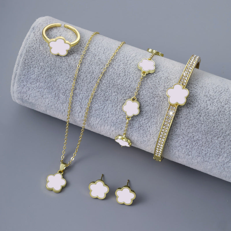 Five-piece floral ladies jewellery set including ring, earrings, bangle, necklace, and chain & bracelet in gift box with bag