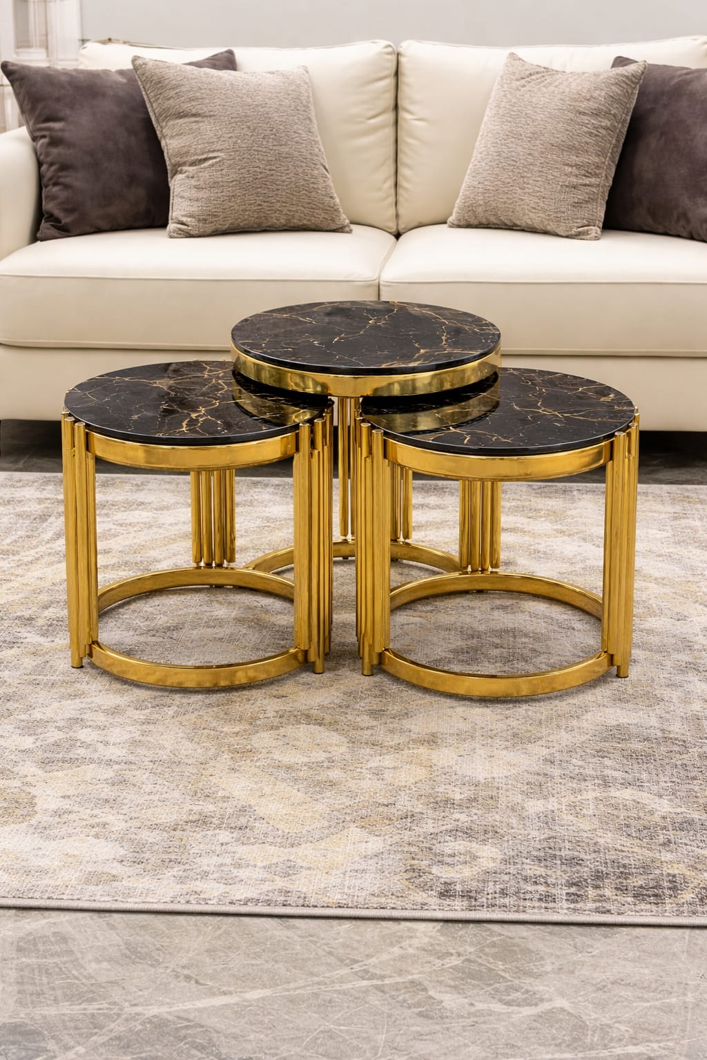 3-piece Round glass nesting tables with golden metal stands, diameters 50cm, 45cm, and 40cm.
