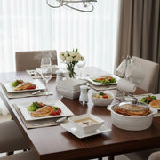 White square 28-piece ceramic dinner set with plates, bowls, cups, casseroles, and salt shaker