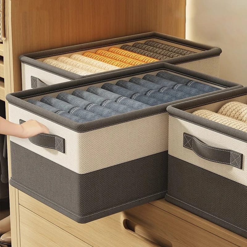 Steel frame wardrobe clothes organizer boxes in assorted sizes for storing pants, shirts, and sweaters.