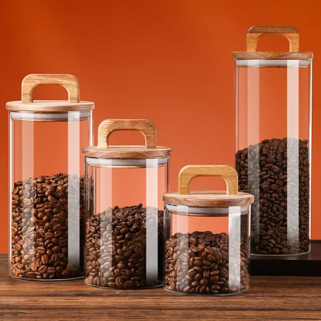 Set of 4 airtight glass jars with wooden lids for storing dry foods and spices, elegant kitchen storage solution
