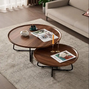 Wooden nesting coffee table set with two tables wood grain tabletop finish black metal legs space saving living room furniture set.