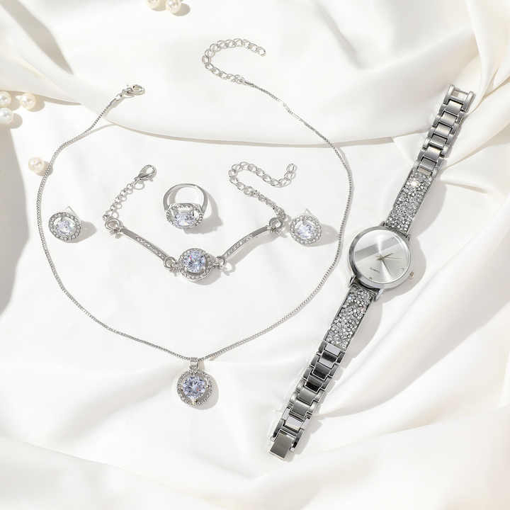 Five piece ladies watch gift set including watch, bracelet, necklace, ring, and earrings
