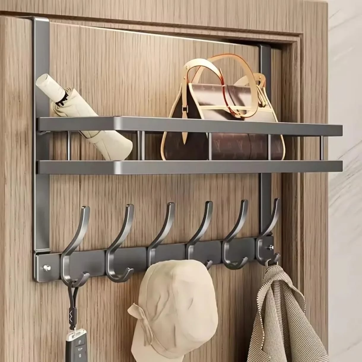 Metallic over the door multipurpose hanger with hooks measuring 43x28cm for home organization. 🖤✨