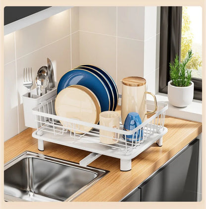 Minimalist white countertop dish drying rack with utensil holder and drainage spout for kitchen organization