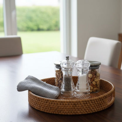 Round rattan serving tray suitable for food serving and home décor.