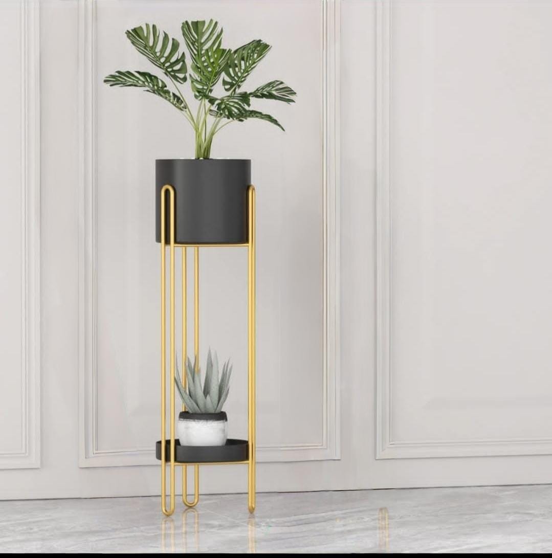 Modern metal plant stand with gold frame, two-level holder for indoor plants and decorative display.