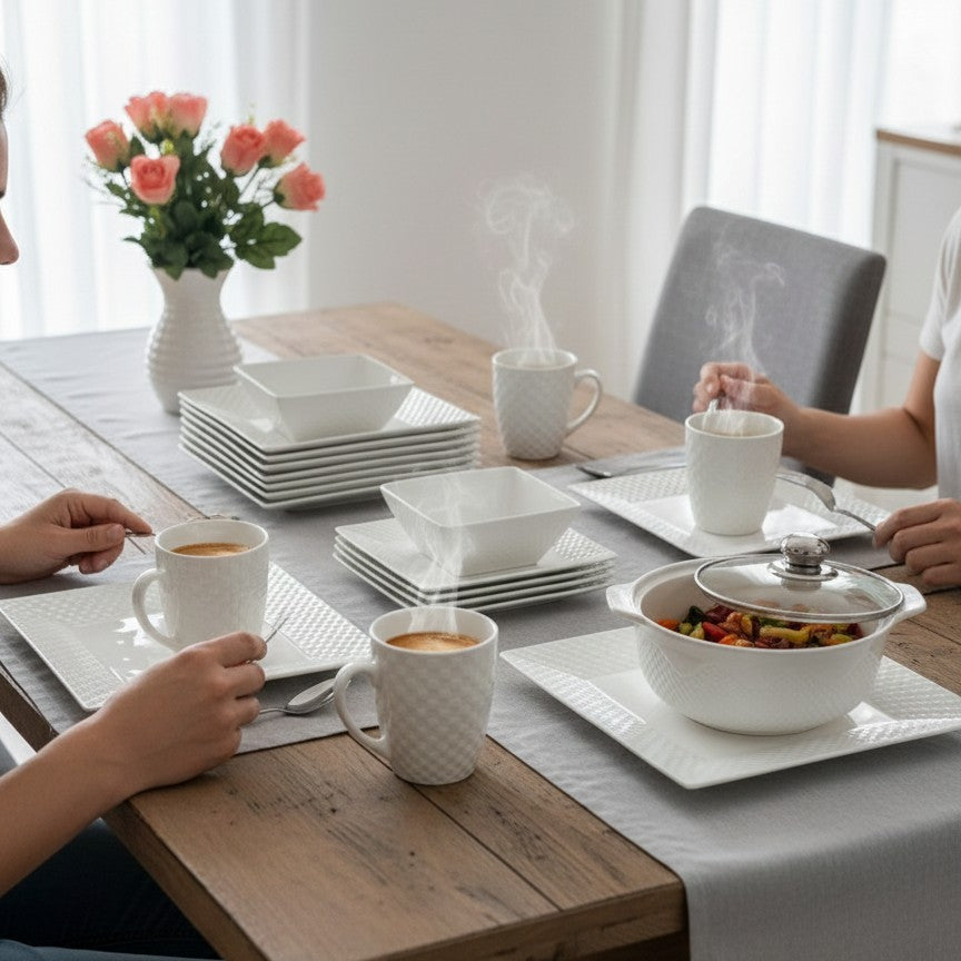 White square 30-piece dinner set with cups, plates, bowls, and glass-lid dishes arranged on a table.